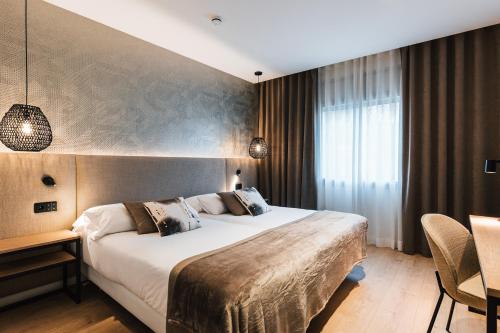 Ein Bett oder Betten in einem Zimmer der Unterkunft Hotel Costabella