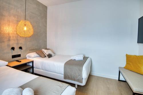 Ein Bett oder Betten in einem Zimmer der Unterkunft Hotel Costabella