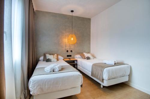 Ein Bett oder Betten in einem Zimmer der Unterkunft Hotel Costabella