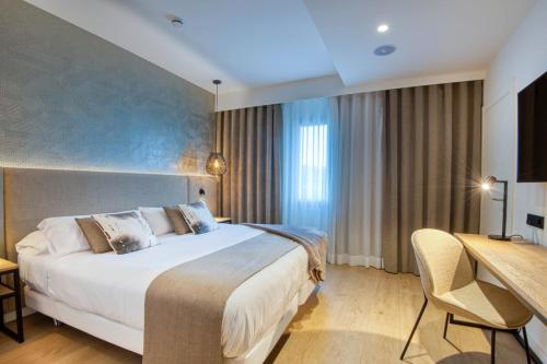 Ein Bett oder Betten in einem Zimmer der Unterkunft Hotel Costabella