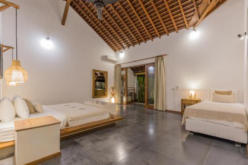 Villa B tesisinde bir odada yatak veya yataklar