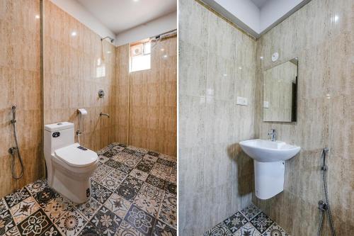 a bathroom with a toilet and a sink at FabHotel Tree Suites - Nr Reva University in Bengaluru