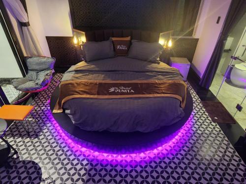 Katil atau katil-katil dalam bilik di Punita Hotel