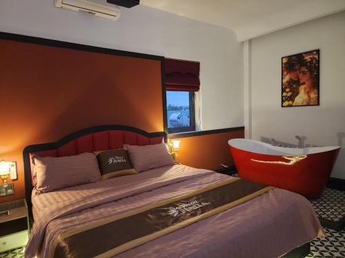 Katil atau katil-katil dalam bilik di Punita Hotel