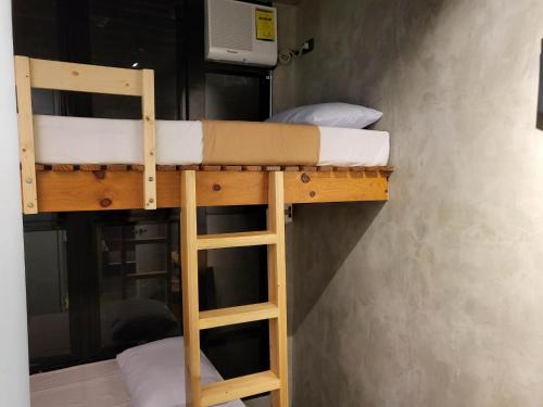 a couple of bunk beds in a room at Ramos Hello Stay Cebu in Cebu City