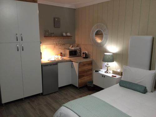 Ένα ή περισσότερα κρεβάτια σε δωμάτιο στο Bay View Guest House