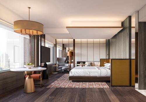 a bedroom with a king sized bed and a desk at Grand Hyatt Singapore in Singapore