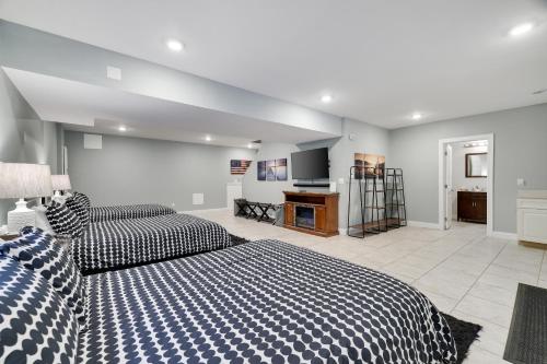 a large bedroom with two beds and a kitchen at Soose Manor Spa BBQ Games and Bar Near Lake in Tafton