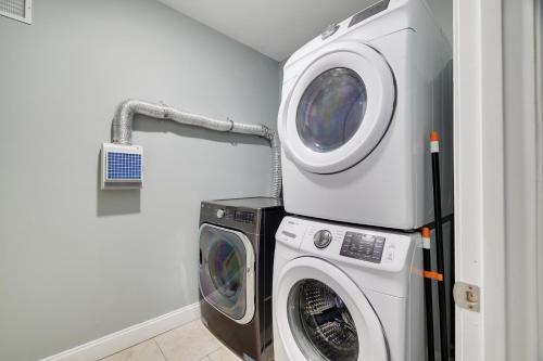a washing machine and a dryer in a laundry room at Soose Manor Spa BBQ Games and Bar Near Lake in Tafton