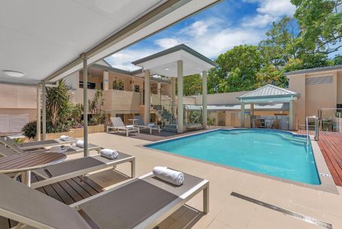 an image of a swimming pool in a house at The Newport on Macrossan - Adults Only in Port Douglas