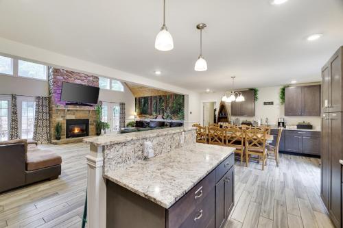 a kitchen with a living room and a dining room at Soose Manor Spa BBQ Games and Bar Near Lake in Tafton