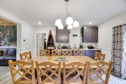 a kitchen and dining room with a table and chairs at Soose Manor Spa BBQ Games and Bar Near Lake in Tafton