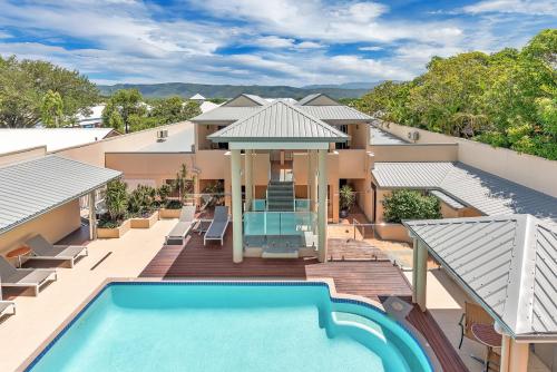 an aerial view of a house with a swimming pool at The Newport on Macrossan - Adults Only in Port Douglas