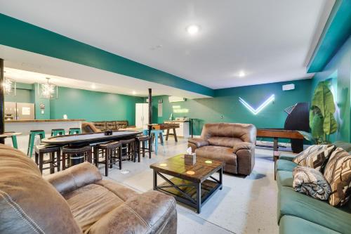 a living room with couches and tables and a bar at Soose Manor Spa BBQ Games and Bar Near Lake in Tafton