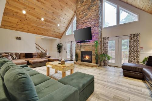 a living room with a couch and a fireplace at Soose Manor Spa BBQ Games and Bar Near Lake in Tafton