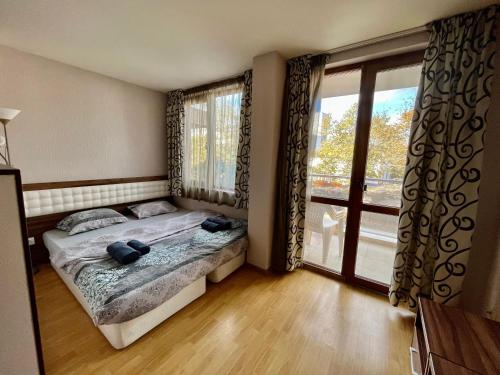 Ένα ή περισσότερα κρεβάτια σε δωμάτιο στο Vadim Apartments in Panorama Beach Vigo Nessebar
