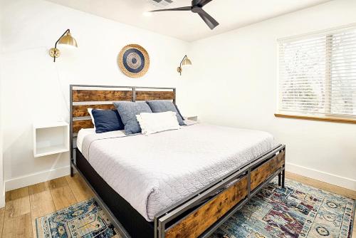 a bedroom with a bed and a ceiling fan at Near Downtown Stylish 2BR With Amazing Patio - #2 in Moab