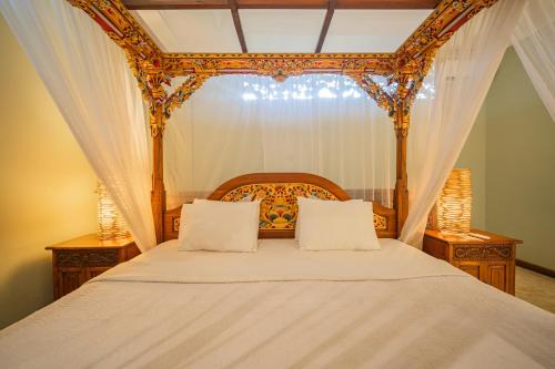Cama o camas de una habitación en Honeymoon Guesthouse