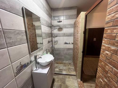 a bathroom with a sink and a toilet and a shower at Trou aux Biches Serenity in Pointe aux Biches