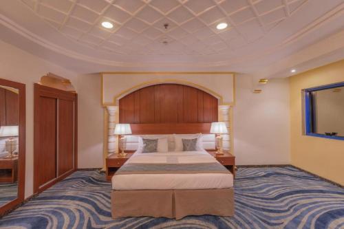 En eller flere senge i et værelse på فندق سنود النرجس