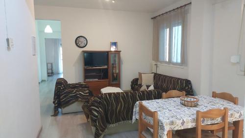 a living room with a couch and a table at Kastoria apartment μπροστά στη λίμνη στο κέντρο in Kastoria