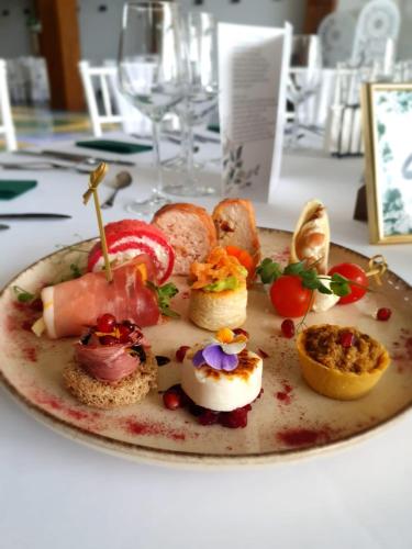 a plate of food sitting on a table at Podu' cu Lanturi in Bacău