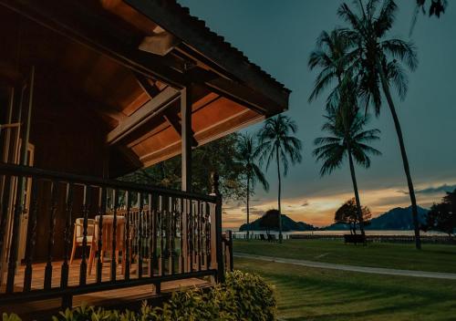 a porch of a house with a view of the ocean at Pelangi Beach Resort & Spa, Langkawi in Pantai Cenang