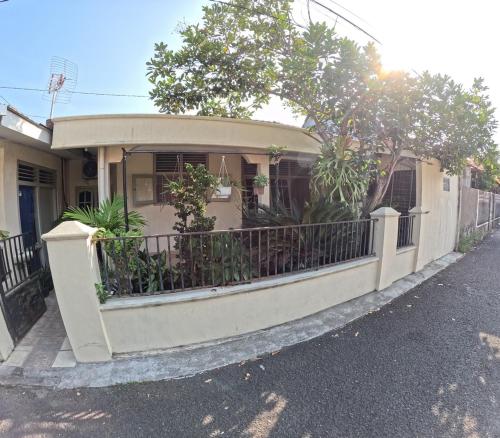 a house with a fence in front of it at Omah Tegalrejo Family Only in Jetis