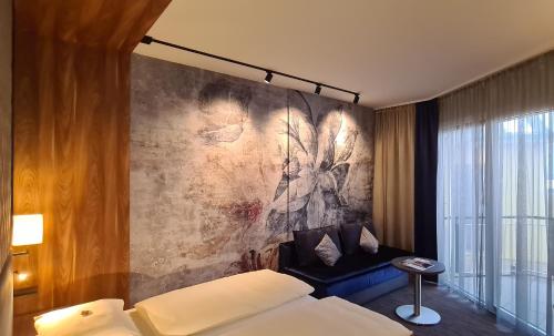 Postel nebo postele na pokoji v ubytování EurothermenResort Bad Schallerbach - Hotel Paradiso Superior