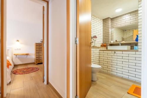 a bathroom with a toilet and a sink at Luxury Designer Beach Front Two Bedroom Apartment in Salou