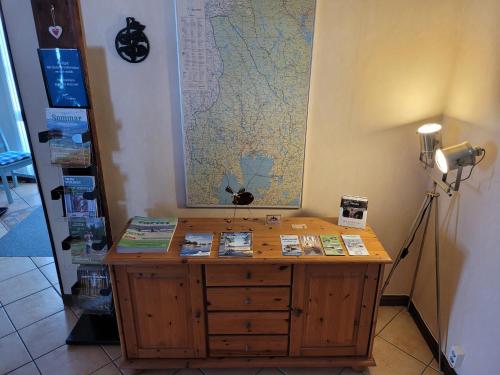 a room with a table with a map on the wall at Wärdshuset Klarälvdalen in Sysslebäck