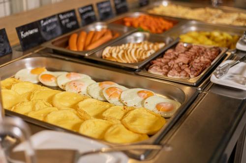 a buffet with many different types of food on display at IQ Hotel in Kyiv