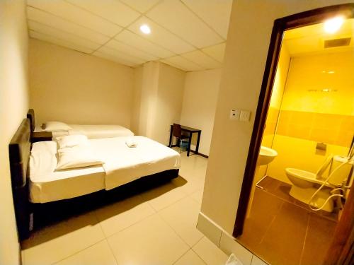 Postel nebo postele na pokoji v ubytování MB Budget Hotel