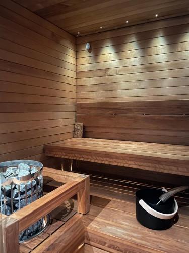 a sauna with a bench and a hat in it at Levi Cranberry C1, ski-in ski-out 2 bedroom apartment in Levi center in Levi
