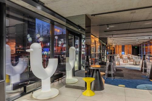 a store front with a large window with tables and chairs at IQ Hotel in Kyiv