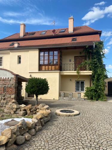 a house with a stone driveway in front of it at Galerie Vila Lucia 5 -Loft apartmán in Plzeň