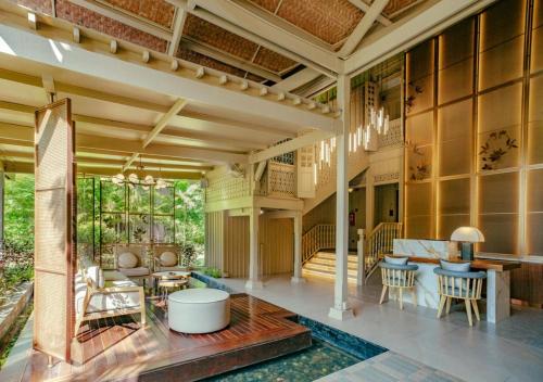 a lobby of a house with a living room at Pelangi Beach Resort & Spa, Langkawi in Pantai Cenang