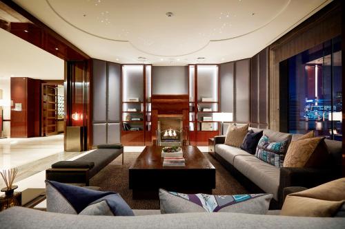 a living room with a couch and a fireplace at Crown Park Hotel Seoul Myeongdong in Seoul