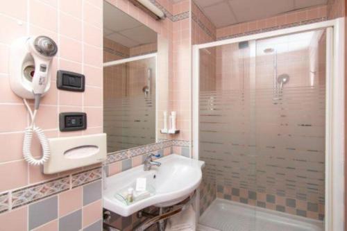 a bathroom with a sink and a shower at Blu Hotel - Sure Hotel Collection by Best Western in Collegno