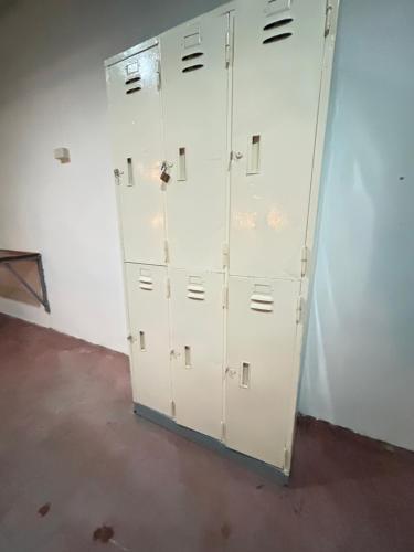 a group of white lockers in a room at Just sleep in Ban Mo Nae