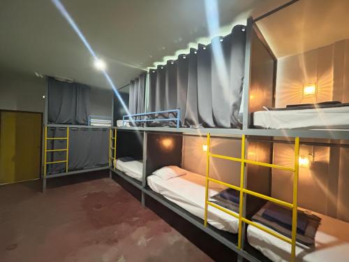 a group of bunk beds in a room at Just sleep in Ban Mo Nae
