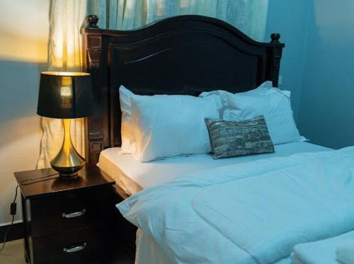 Un pat sau paturi într-o cameră la Haven Homes