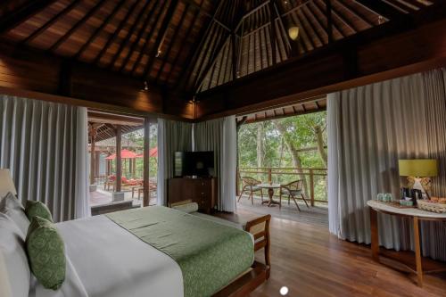 Ένα ή περισσότερα κρεβάτια σε δωμάτιο στο AnandaDara Ubud Resort & Spa