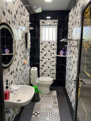 a bathroom with a sink and a toilet at Sepang Putra Bagan Lalang Semi D House in Sungai Pelik