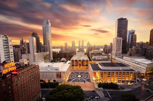 a view of a city skyline at sunset at The Empire Hotel New York in New York