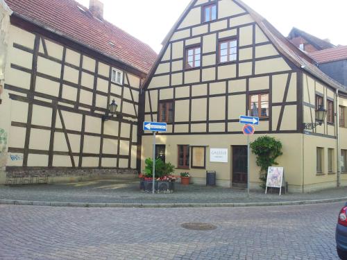 a couple of half timbered buildings on a street at Ferienwohnung im Denkmal in Havelberg