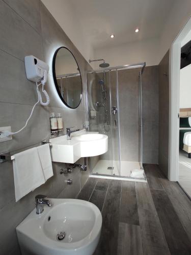 a bathroom with a sink and a shower at Massimi City Garden in Rome