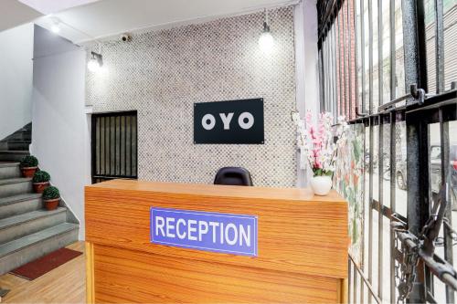 a reception desk with a sign that reads oxy reception at Green Park Residency in New Delhi