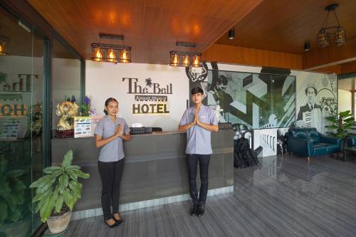 two women standing in front of a hotel at The Bell Airport Phuket Hotel - SHA Extra Plus in Nai Yang Beach