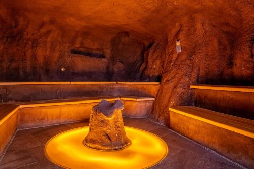 a room with a rock sitting on a yellow table at Résidence Pierre & Vacances Premium Arc 1950 Le Village in Arc 1950